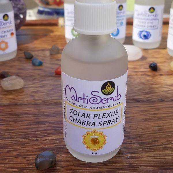 Solar Plexus Chakra Spray bottle with essential oils and crystal, promoting personal power and well-being.