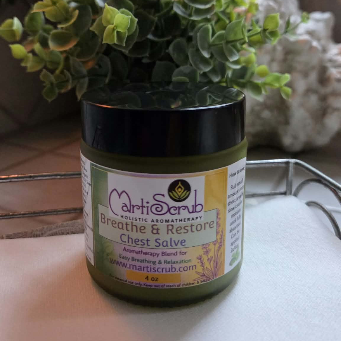 Breathe & Restore Chest Salve in a jar promoting easy breathing and relaxation with holistic aromatherapy.