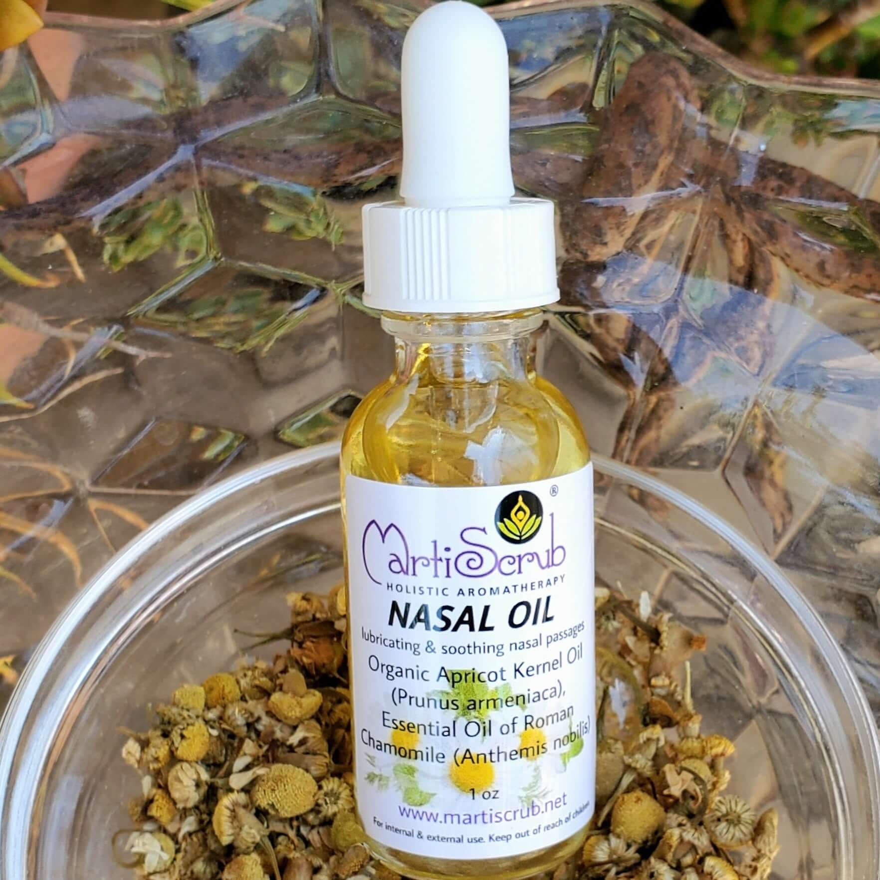 1 oz bottle of MartiScrub Nasal Oil with organic apricot kernel and Roman chamomile, ideal for soothing dry nasal passages.