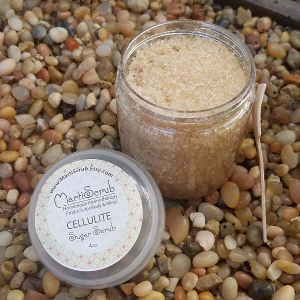 Organic Cellulite Sugar Scrub in jar, made with essential oils, perfect for reducing dimpled cellulite appearance.